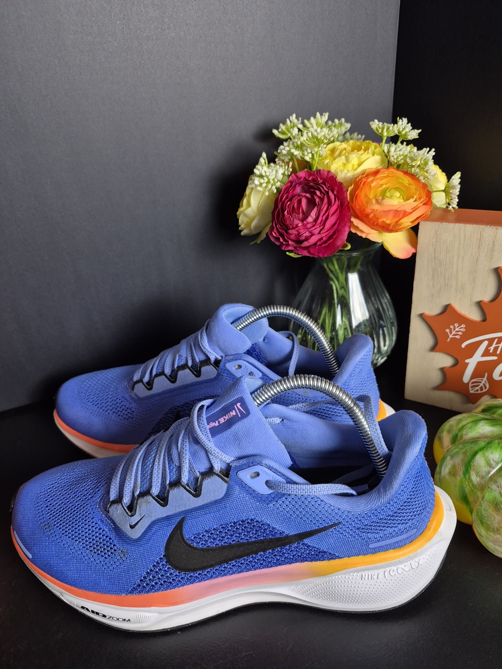Nike Women’s Blue Athletic Shoes with Black Swoosh and Orange Accent.Size 10